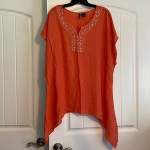 Orange Shirt with detail around the neckline